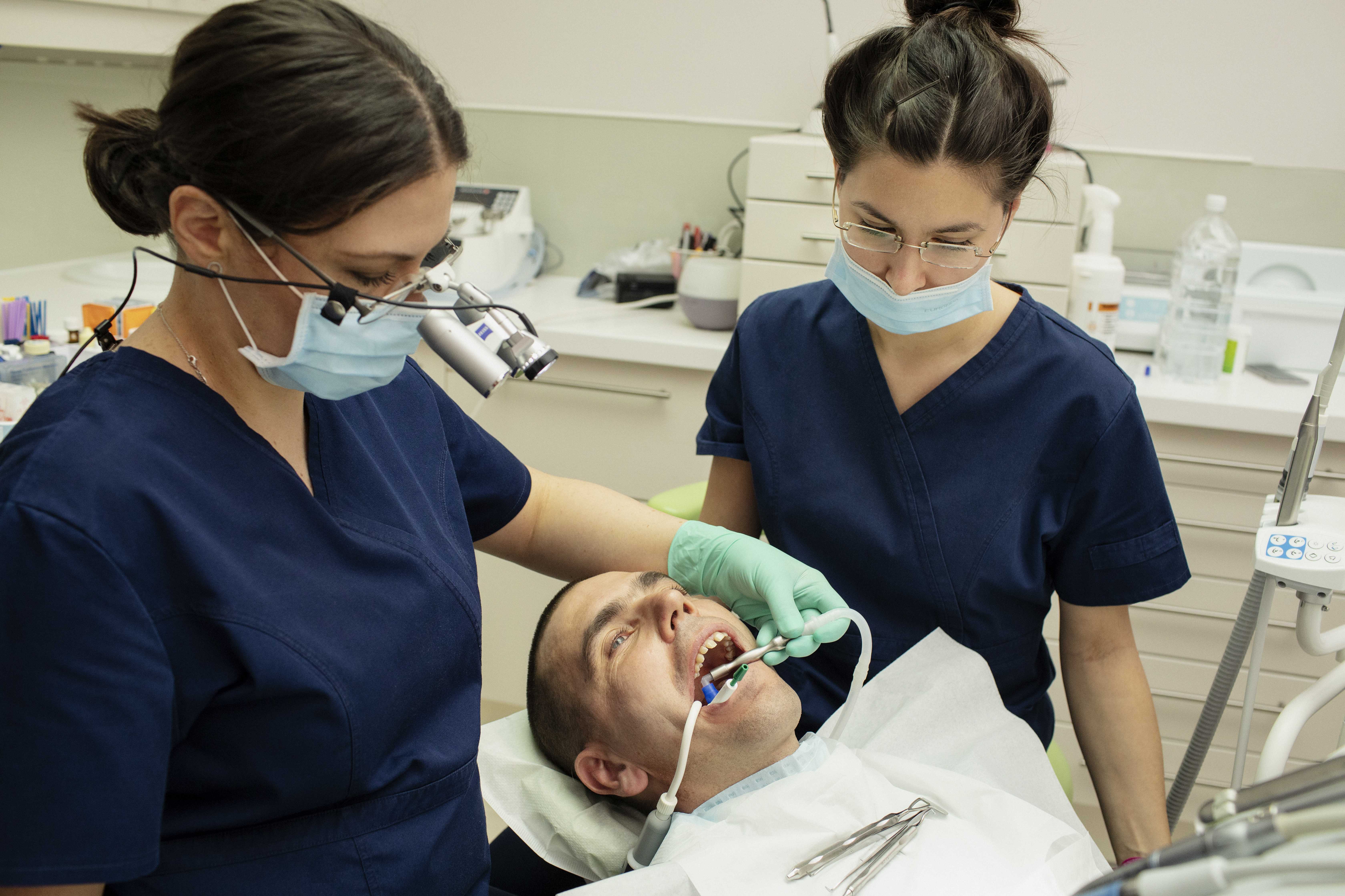 Clinicians working under magnification at Johanna Dental, Budapest